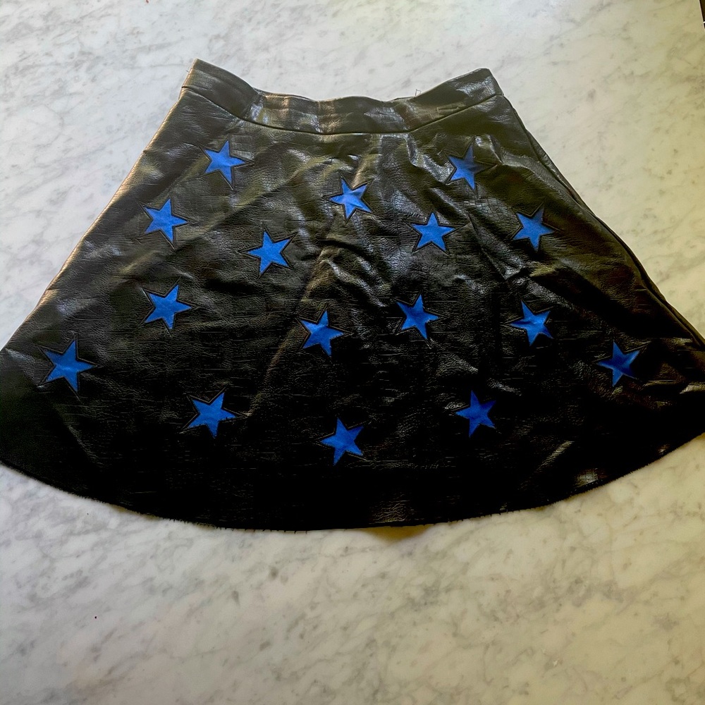 Black pleather skirt with blue star detail